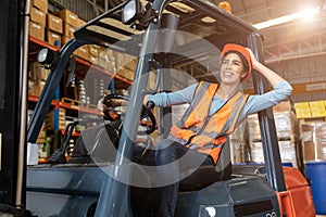 Happy woman worker warehouse staff forklift driver happy smiling enjoy working Asian people
