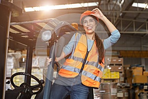 Happy woman worker warehouse staff forklift driver happy smiling enjoy working Asian people