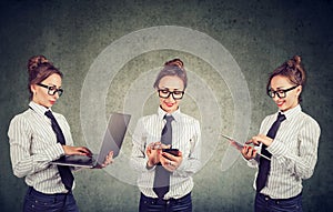 Happy woman working using multiple devices