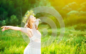 Happy woman in wreath summer enjoying life opening hands