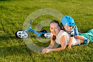 Happy woman and child having fun outdoor on meadow