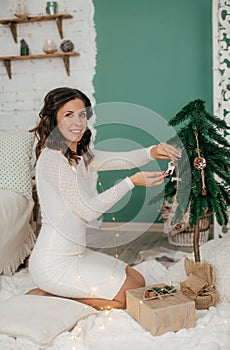 Happy women in Christmas decorations feeding black