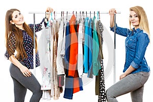 Happy women clothes shopping