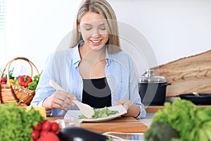 Happy women cooking in the kitchen