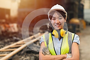 Happy women engineer Asian worker female work in factory portrait smile standing arm fold confidence look