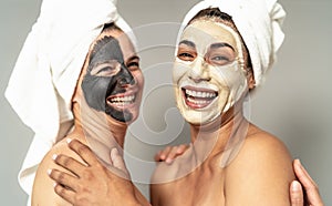 Happy women with facial mask having skin care spa day