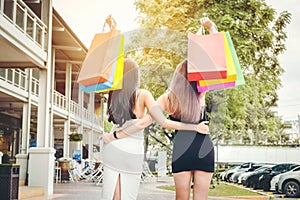 Happy women friendship Enjoying Spending shopping bags in Fashion shopping street