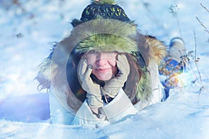 Happy women laying in the snow