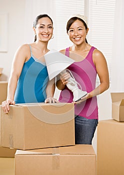 Happy women moving into new home