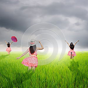 Happy Women in rice fields and rainclouds