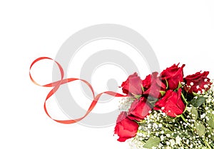 Happy Women`s Day concept - beautiful bouquet of red roses and baby`s breath white flowers isolated on a white background with