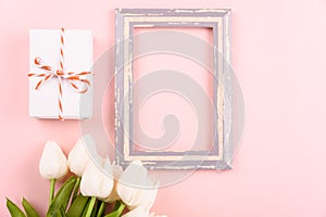 Happy Women`s Day, Mother`s Day concept. top view flat lay photo frame, gift box and Tulip flower