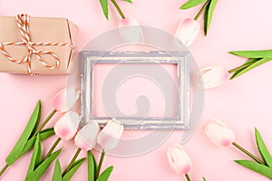 Happy Women`s Day, Mother`s Day concept. top view flat lay photo frame, gift box and Tulip flower