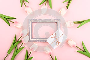 Happy Women`s Day, Mother`s Day concept. top view flat lay photo frame, gift box and Tulip flower