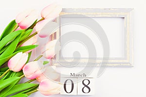 Happy Women`s Day, Mother`s Day and Valentine`s Day concept. top view flat lay Tulip flower and photo frame