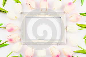 Happy Women`s Day, Mother`s Day and Valentine`s Day concept. top view flat lay Tulip flower and photo frame