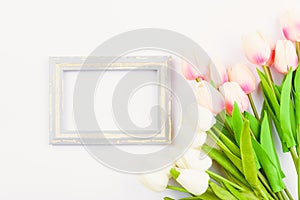 Happy Women`s Day, Mother`s Day and Valentine`s Day concept. top view flat lay Tulip flower and photo frame