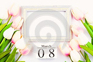 Happy Women`s Day, Mother`s Day and Valentine`s Day concept. top view flat lay Tulip flower and photo frame