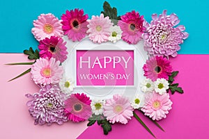 Happy Women`s Day Pastel Candy Colours Background. Floral flat lay.