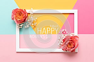 Happy Women`s Day Pastel Colored Background. Flat lay greeting card with beautiful coral hue roses.