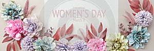 Happy Women`s Day Pastel and Muted Tones Banner. Flat lay floral greeting card with beautiful silk flowers.