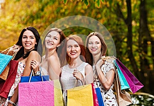 Happy Women with Shopping Bags