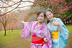 Happy women wearing traditional kimono travel