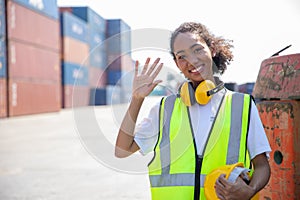 Happy women worker, young teen girl portrait greeting at shipping cargo work site