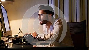 Happy worker at desk at home