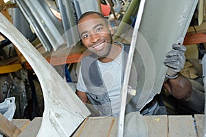 Happy worker in garage