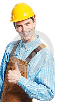 Happy worker in hardhat and overall with thumb up