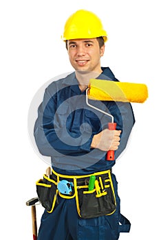 Happy worker man holding paint roller