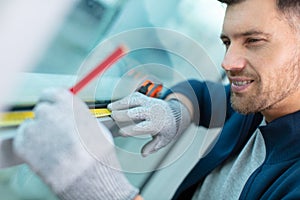 happy worker measures window