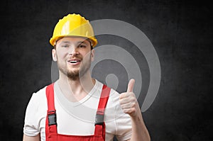 Happy worker showing thumbs up sign