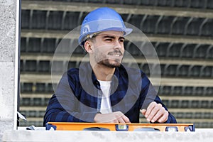 happy worker uses level for window
