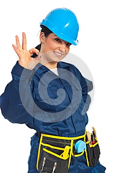 Happy worker woman showing okay