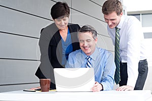 Happy working business team in modern office