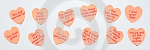 Happy World or National Compliment Day. Pink paper stickers in heart shape with text of popular compliments for beautiful lady photo