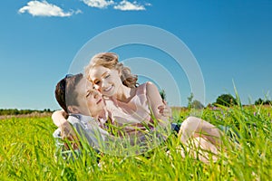 Happy young adult couple in love on the field. Two, man and wom