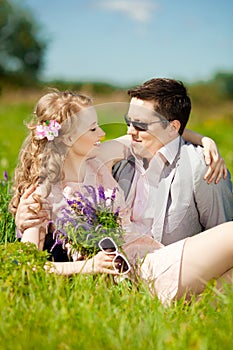 Happy young adult couple in love on the field. Two, man and wom