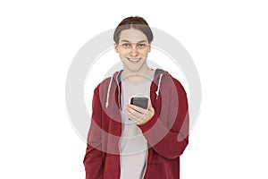 Happy young adult man using smart phone cellphone for calls, social media, mobile application online isolated in white background