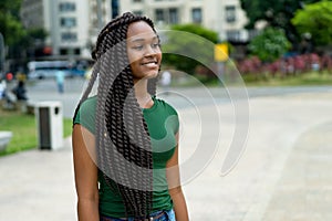 Happy young adult woman from Africa with amazing hairstyle photo