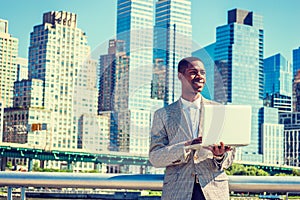 Happy Young African American Businessman traveling, working in N