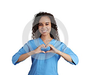 Happy young African-American doctor making heart with hands on white background