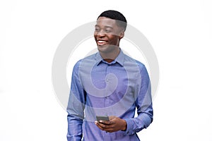 Happy young african american man with cellphone against isolated white background