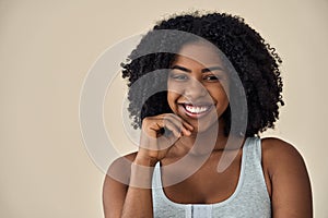 Happy young African American woman beauty model at beige background. Portrait.