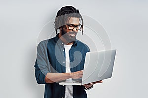 Happy young African man in eyewear