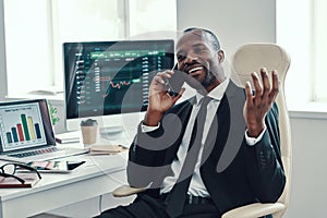 Happy young African man in formalwear