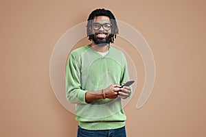 Happy young African man in smart casual clothing