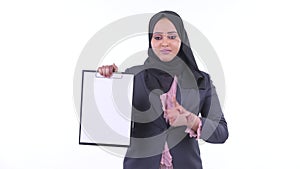 Happy young African Muslim businesswoman showing clipboard and giving thumbs up